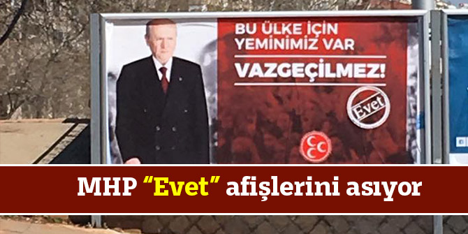 MHP “Evet” afişlerini asıyor