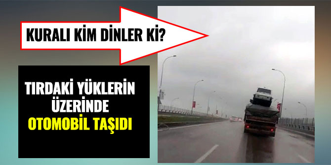 TIRDAKİ YÜKLERİN ÜZERİNDE OTOMOBİL TAŞIDI